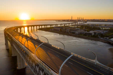 High-speed toll road, highway bypassing the city center St. Petersburg, the central section of the western high-speed section. A beautiful view of the sunset over the Gulf of Finlandの写真素材