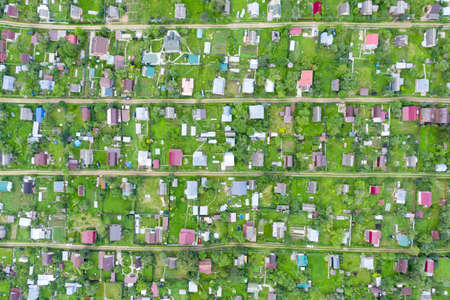 Village top view or vegetable gardens in the summer. Country houses view from the droneの写真素材