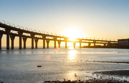 High-speed toll road, highway bypassing the city center St. Petersburg, the central section of the western high-speed section. A beautiful sunset over the Gulf of Finlandの写真素材