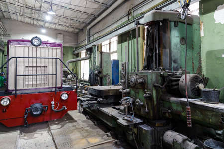 Old Soviet lathe, machine tool equipment. Locksmith shop in the railway depotの写真素材