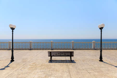 A picturesque panorama of the sea coast with a sandy beach in a resort, beautiful and deserted embankment of the resort town of Anapaの写真素材