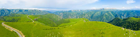 A wonderful mountain road with a serpentine in the North Caucasus from the Narzan Valley to Dzhily-Su, Russiaの写真素材