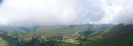 A wonderful mountain road with a serpentine in the North Caucasus from the Narzan Valley to Dzhily-Su, Russiaの写真素材