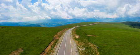 A wonderful mountain road with a serpentine in the North Caucasus from the Narzan Valley to Dzhily-Su, Russiaの写真素材