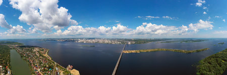 a panoramic view of the banks of the Volga River near Saratov, an automobile bridge across the river in the city limitsの写真素材