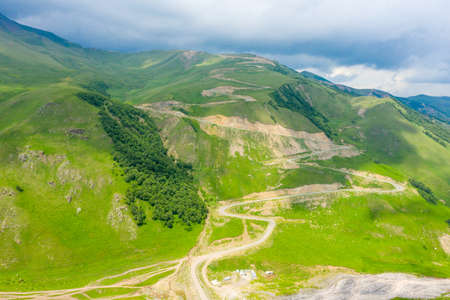 A wonderful mountain road with a serpentine in the North Caucasus from the Narzan Valley to Dzhily-Su, Russiaの写真素材