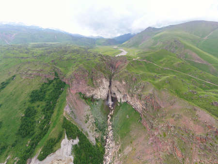 A wonderful mountain road with a serpentine in the North Caucasus and Sultan waterfallの写真素材