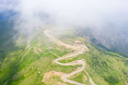 A wonderful mountain road with a serpentine in the North Caucasus from the Narzan Valley to Dzhily-Su, Russiaの写真素材