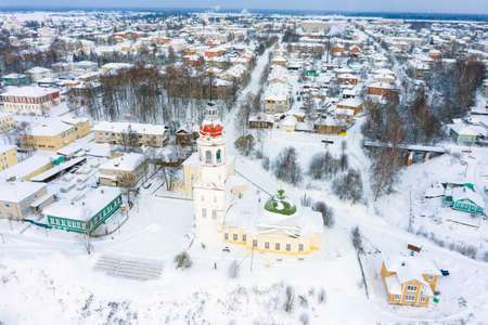 Panorama of a small city in the depths of Russia from a height. Orthodox churches and traditional old wooden houses, Totma and winter city viewの写真素材