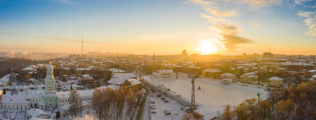 the city of Kirov and the high bank of the river Vyatka and the Alexander Grin Embankment and the rotunda on a sunny winter dayの写真素材