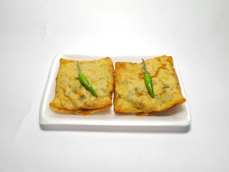 A snack from Indonesia made from egg flour and fried vegetables is called salted martabak