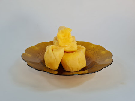 Yellow cassava tape in a brown plate