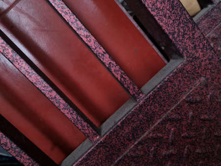 Background with the image of a door made of reddish brown ironの写真素材