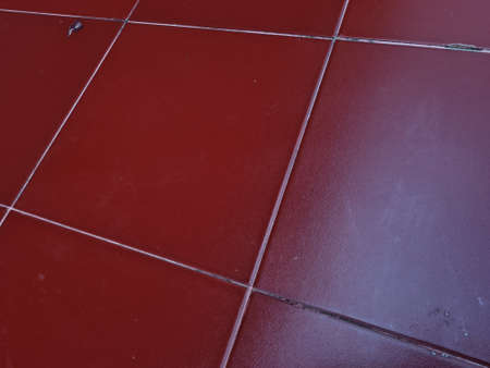 The floor of the building is made of red checkered porcelainの写真素材