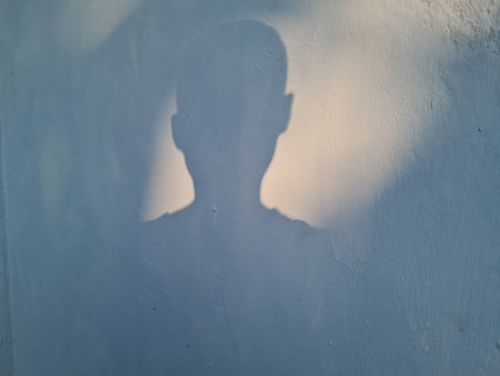 Abstract background of boy shadow on building wall in blue paint color