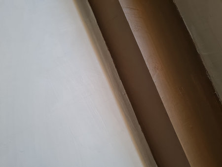 Abstract background photo depicting a wall with white paint combined with brown paint