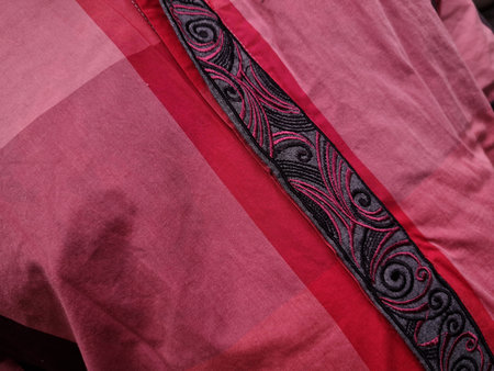 Red dress background with a combination of black artistic decorations