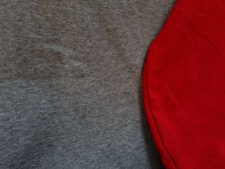 Abstract cloth background textured gray clothes combined with redの写真素材