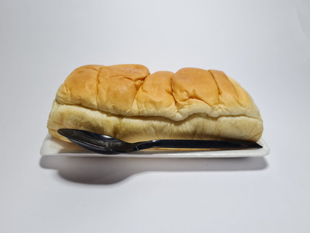 Chocolate flavored bread that can be torn by hand in a white container