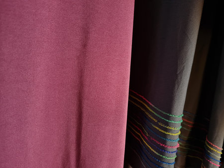 Abstract textured hijab cloth background in gray and red with a combination of colored stripes