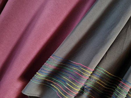 Abstract textured hijab cloth background in gray and red with a combination of colored stripes