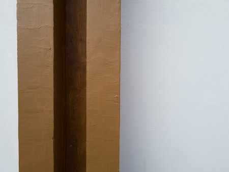 Abstract background textured building wall in brown and whiteの写真素材