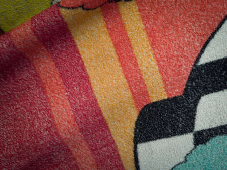 Abstract textured background of red blankets combined with other colorsの写真素材