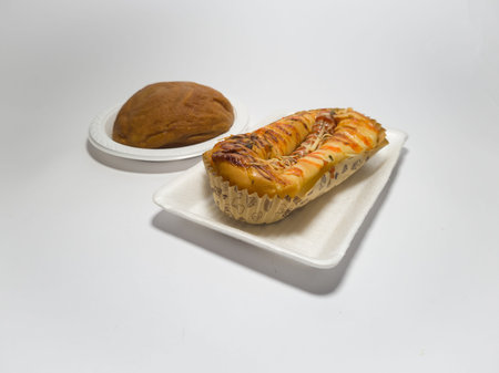 Brown sweet bread and savory sausage stuffed bread topped with tomato sauce