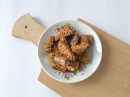 Fried chili dish made from sliced tempeh and sliced chicken liverの写真素材