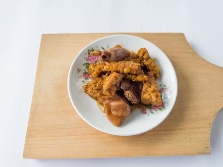 Fried chili dish made from sliced tempeh and sliced chicken liverの写真素材
