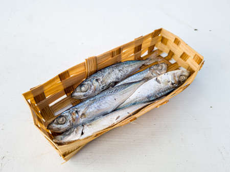 Marinated sea fish in bamboo containers and ready to be marketedの写真素材