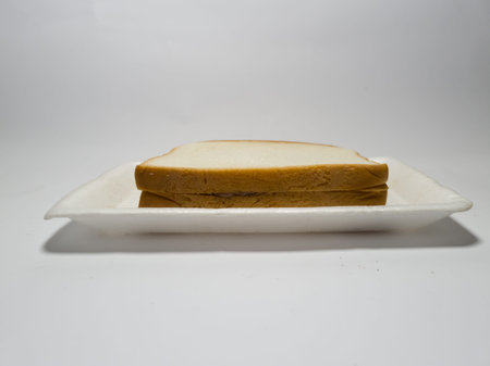 White bread stuffed with chocolate on a white background