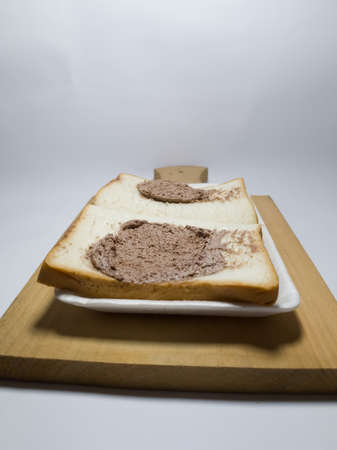 White bread stuffed with chocolate on a white backgroundの写真素材