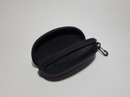 A black eyeglass holder made of cloth and plastic