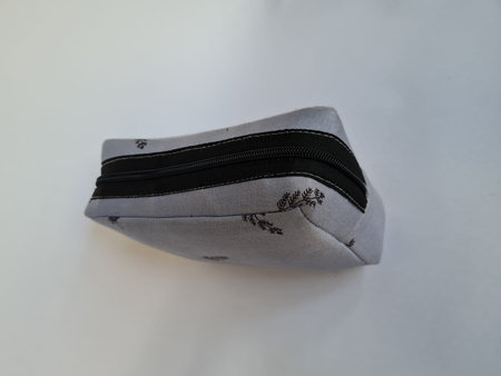 Small gray patterned bag for mukena holder on a white background