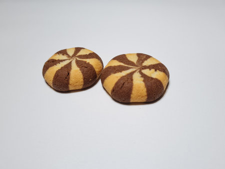 Snacks of chocolate-flavored biscuit cookies made from flour and other ingredients