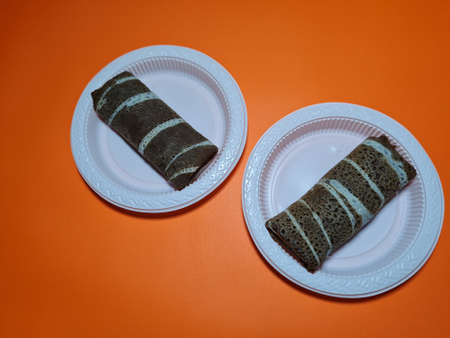 A typical Indonesian snack made from flour and other ingredients called omelet rolls sweetの写真素材