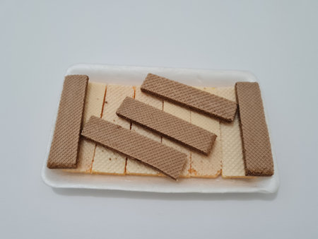 Snacks are wafers that are layered in a containerの写真素材
