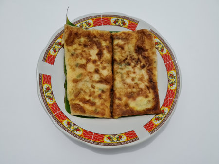 Fried omelette dish filled with vegetables and meat, this dish comes from Asiaの写真素材