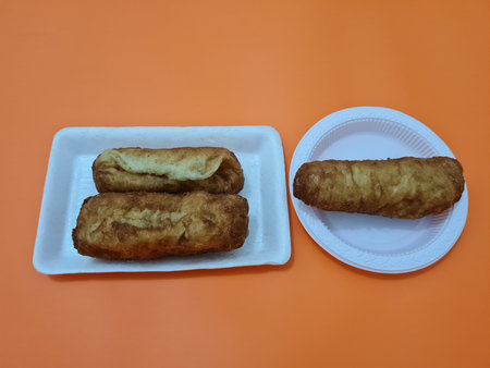 Snacks from the market are fried bread that is oval in shape with a sweet taste