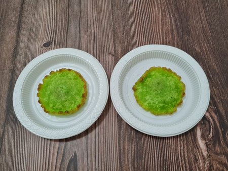 A market snack made from flour and other ingredients is called kue kucur green