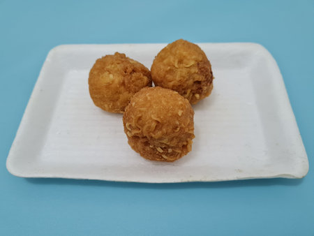 A round-shaped snack made of tofu and noodles which has a savory taste, is called round tofu