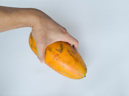 Ripe papaya that has not been peeled has a yellow-green skin colorの写真素材