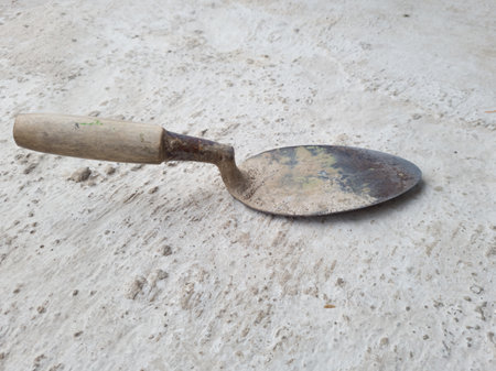 A building tool called a small cement spoon, usually for attaching wet cement to walls or other thingsの写真素材
