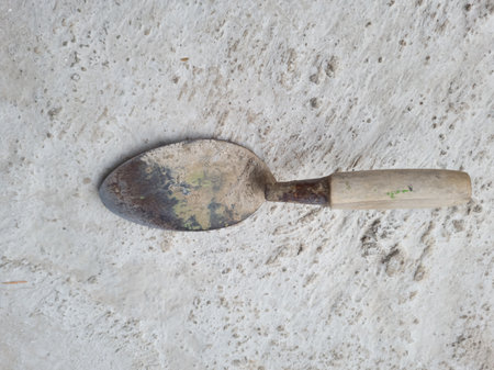 A building tool called a small cement spoon, usually for attaching wet cement to walls or other thingsの写真素材