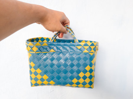 Blue and yellow plastic knitted shopping bagの写真素材