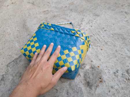Blue and yellow plastic knitted shopping bagの写真素材