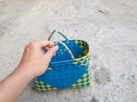 Blue and yellow plastic knitted shopping bagの写真素材
