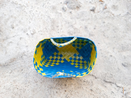 Blue and yellow plastic knitted shopping bagの写真素材