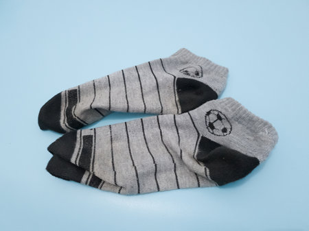striped socks for clothing on a blue background, close-upの写真素材